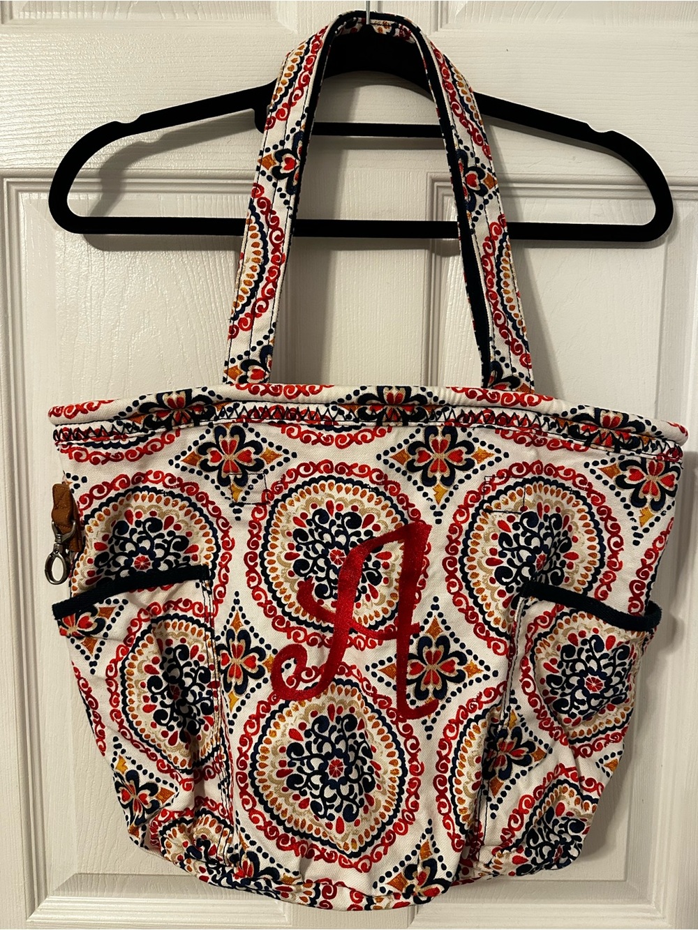 Thirty one Retro Metro tote in sunset medallion, monogrammed “A”.